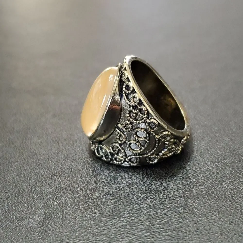 Gold tone ring with stone